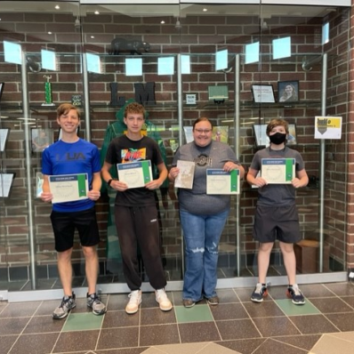 students smiling holding certificate